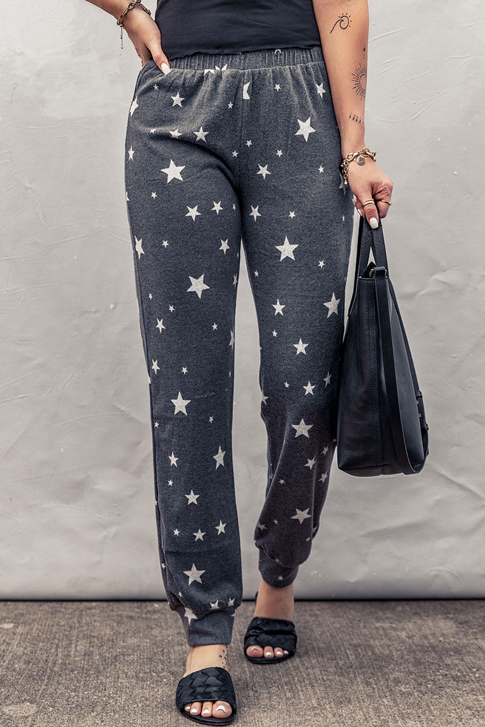 Pantalones deportivos con cintura elástica y estampado de estrellas en color gris