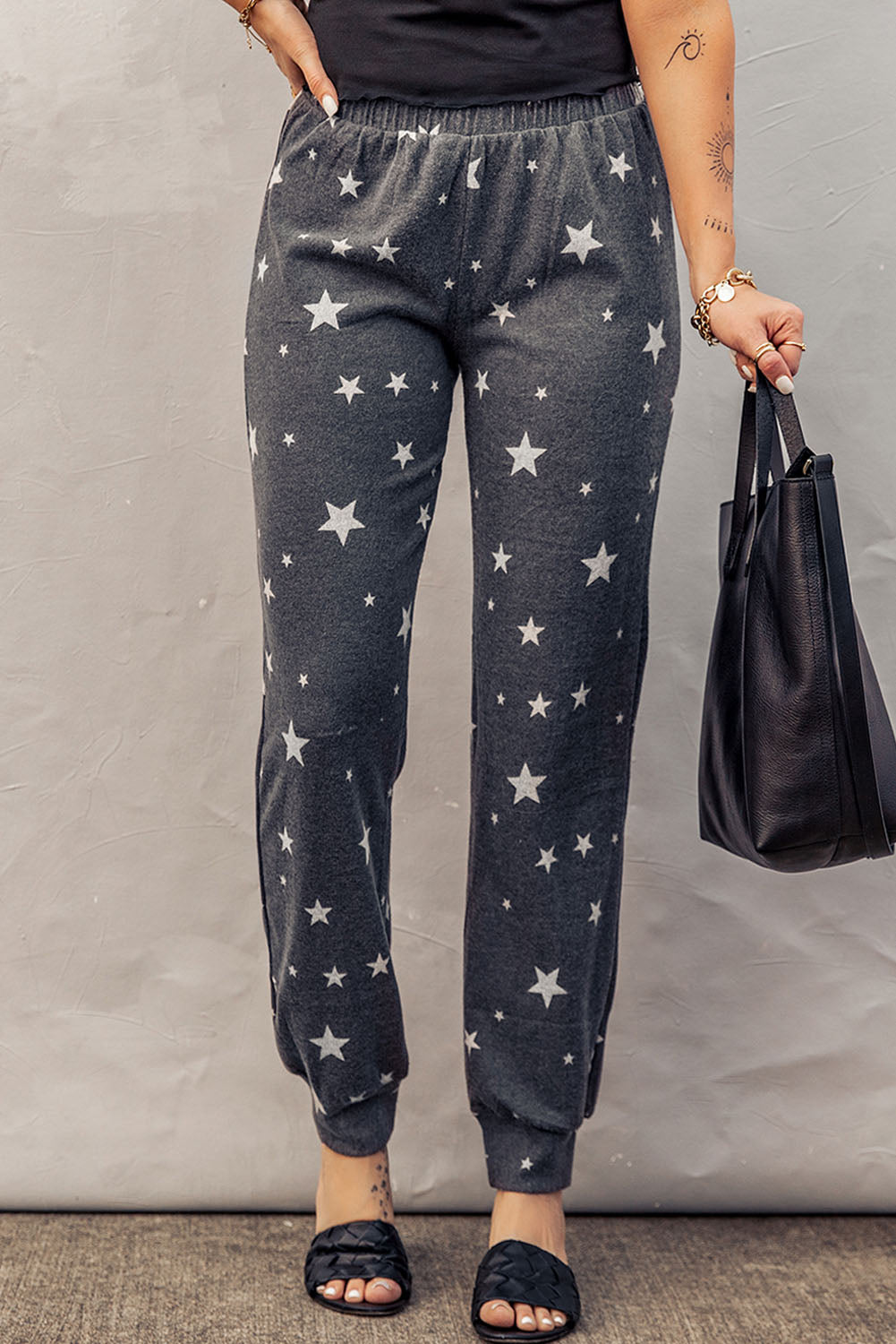 Pantalones deportivos con cintura elástica y estampado de estrellas en color gris