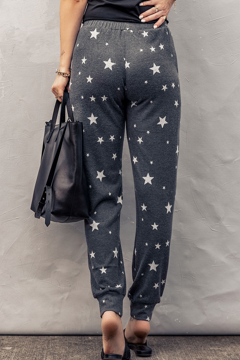 Pantalones deportivos con cintura elástica y estampado de estrellas en color gris